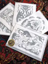 Moltéa linocut prints laid out on a Persian rug
